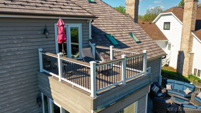 wooden terrace with an outdoor hangout area