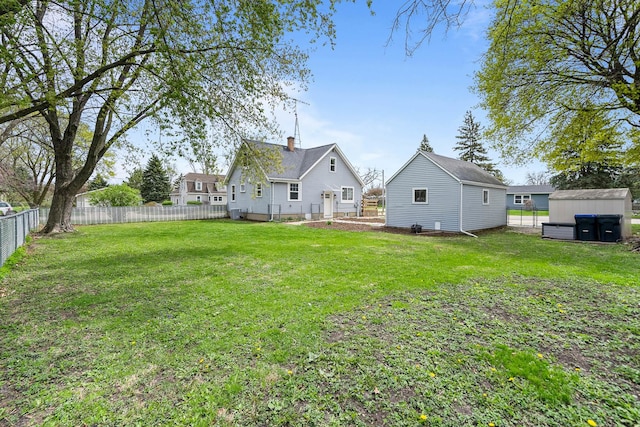 112 E Page St, Elkhorn, WI 53121 - view of yard featuring a fenced backyard, an outdoor structure, and a storage shed
