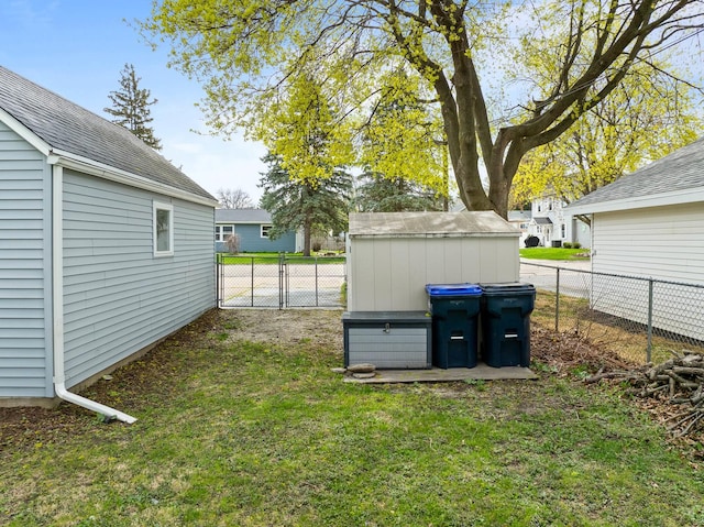 112 E Page St, Elkhorn, WI 53121 - view of yard with a fenced backyard, an outdoor structure, and a storage shed