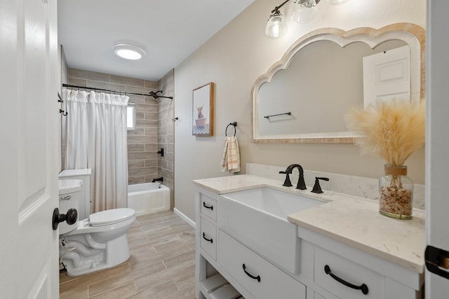 112 E Page St, Elkhorn, WI 53121 - full bathroom featuring vanity, shower / bathtub combination with curtain, wood finish floors, and toilet