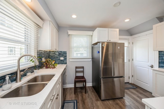 3917 Home Ave, Stickney, IL 60402 - kitchen with appliances with stainless steel finishes, a sink, decorative backsplash, white cabinetry, and recessed lighting