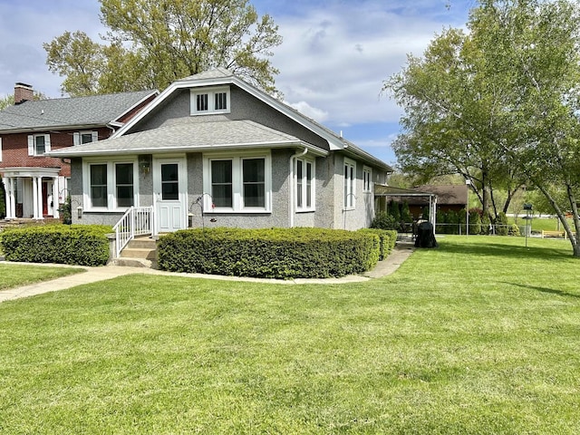 bungalow-style home with a front yard