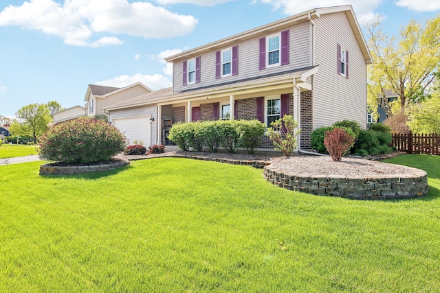 2825 Colonial Dr, Elgin, IL 60124 - traditional home with a garage, covered porch, and brick siding