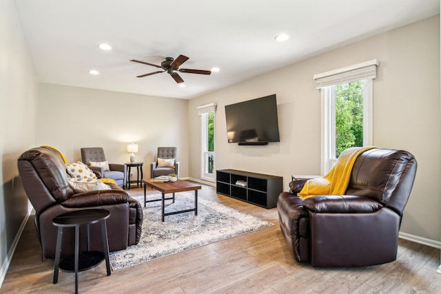 2825 Colonial Dr, Elgin, IL 60124 - living room with healthy amount of natural light, a ceiling fan, wood finished floors, recessed lighting, and baseboards