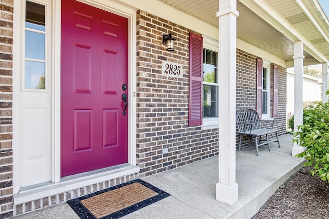 2825 Colonial Dr, Elgin, IL 60124 - entrance to property featuring covered porch and brick siding