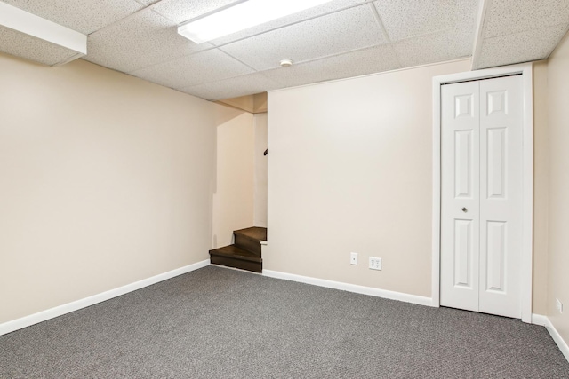 2825 Colonial Dr, Elgin, IL 60124 - finished below grade area with a paneled ceiling, carpet, and baseboards
