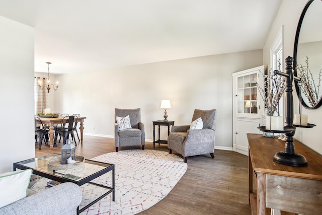 2825 Colonial Dr, Elgin, IL 60124 - living area featuring a chandelier, wood finished floors, and baseboards