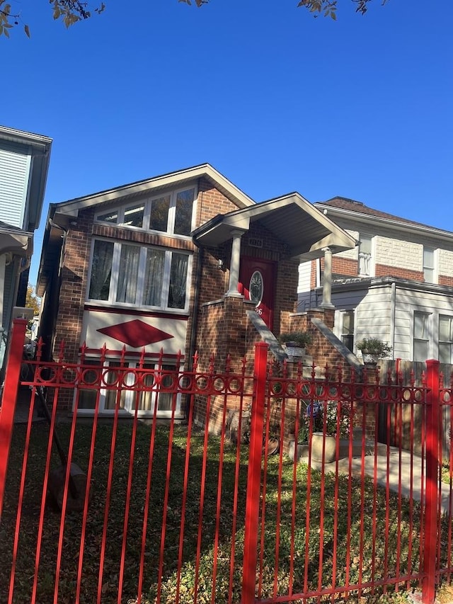 2126 N Kostner Ave, Chicago, IL 60639 - view of front of house featuring brick siding and fence