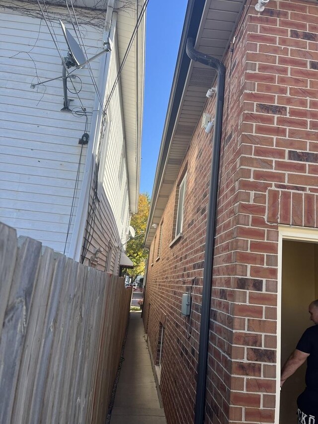 2126 N Kostner Ave, Chicago, IL 60639 - view of side of home with fence and brick siding