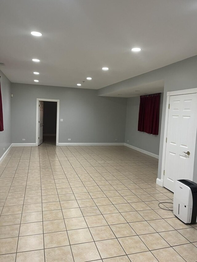 2126 N Kostner Ave, Chicago, IL 60639 - below grade area with baseboards, recessed lighting, and light tile patterned flooring