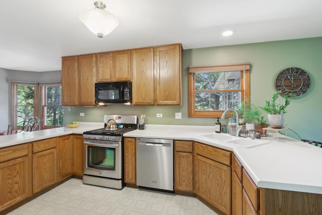 2835 Randall Ridge Ct, Elgin, IL 60124 - kitchen featuring appliances with stainless steel finishes, a sink, a peninsula, and light countertops