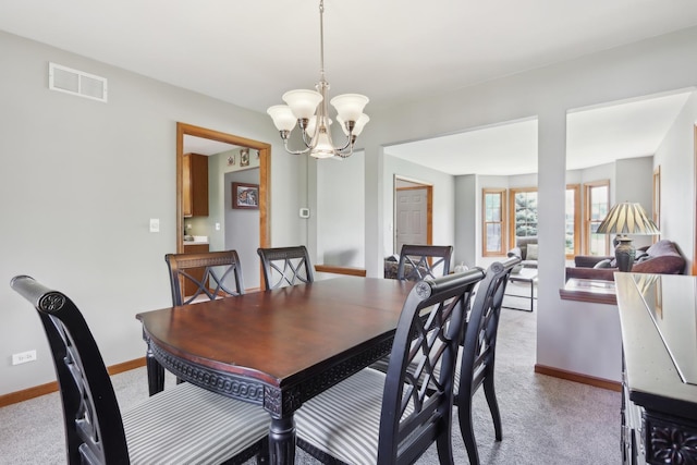 2835 Randall Ridge Ct, Elgin, IL 60124 - dining room with carpet flooring, baseboards, and a chandelier