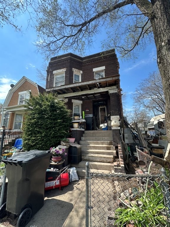 view of front of home featuring brick siding