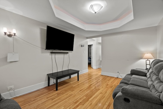 6401 23rd St Unit 2, Berwyn, IL 60402 - living area with a tray ceiling, baseboards, and light wood finished floors