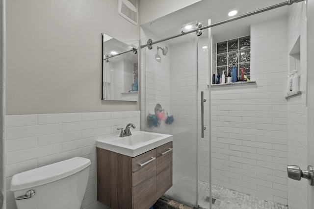6401 23rd St Unit 2, Berwyn, IL 60402 - bathroom featuring visible vents, a shower stall, toilet, and vanity