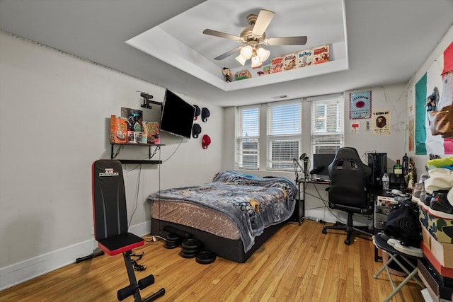 6401 23rd St Unit 2, Berwyn, IL 60402 - bedroom with ceiling fan, a raised ceiling, baseboards, and wood finished floors