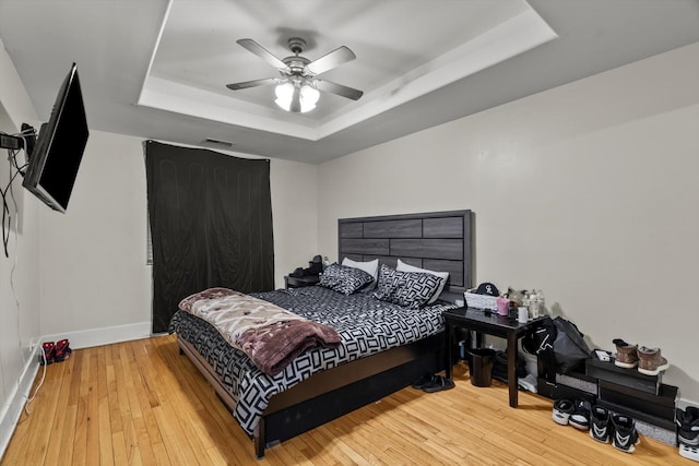 6401 23rd St Unit 2, Berwyn, IL 60402 - bedroom with ceiling fan, wood-type flooring, baseboards, a tray ceiling, and visible vents
