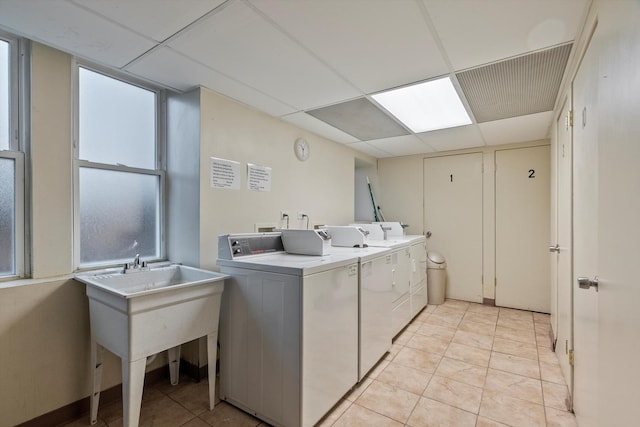 6401 23rd St Unit 2, Berwyn, IL 60402 - community laundry room with washing machine and clothes dryer and light tile patterned floors