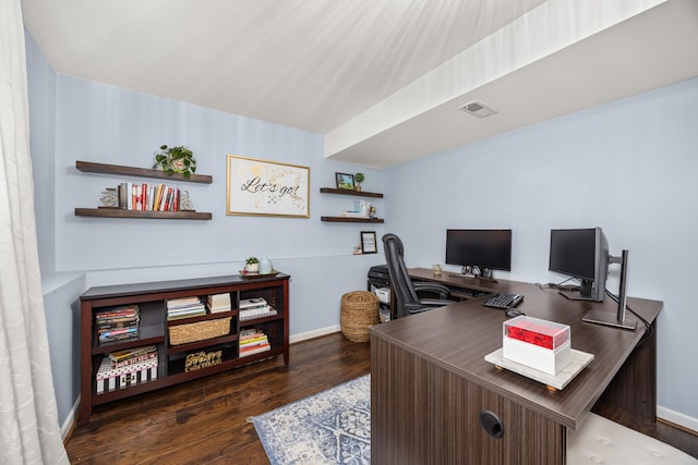 office space featuring baseboards, wood finished floors, and visible vents