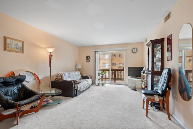 living room with carpet and visible vents