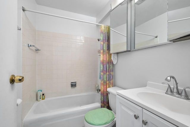 full bath with shower / bath combination with curtain, toilet, and vanity
