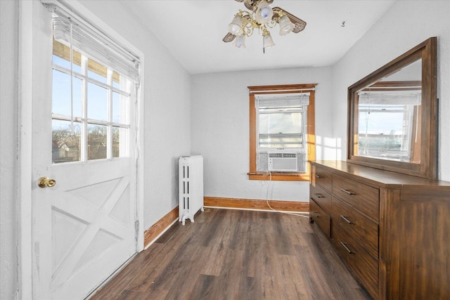 141 Park Ave, Dekalb, IL 60115 - entryway featuring a ceiling fan, baseboards, cooling unit, dark wood-style floors, and radiator