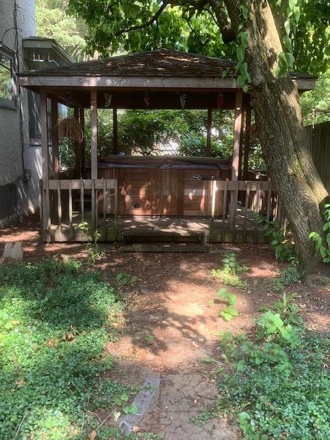 141 Park Ave, Dekalb, IL 60115 - view of yard featuring a gazebo and a jacuzzi