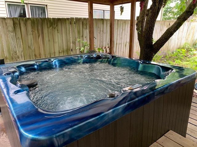 141 Park Ave, Dekalb, IL 60115 - details featuring a jacuzzi and fence