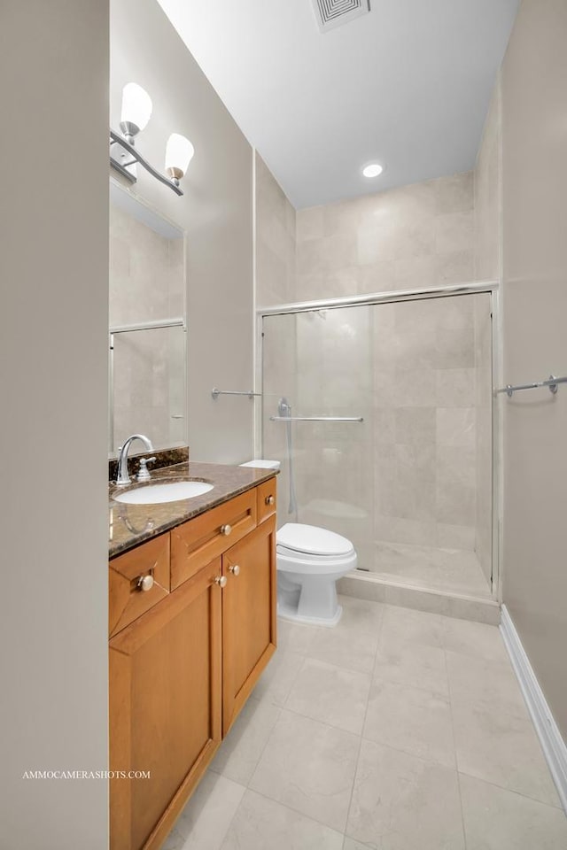full bathroom with tile patterned flooring, vanity, toilet, visible vents, and tiled shower