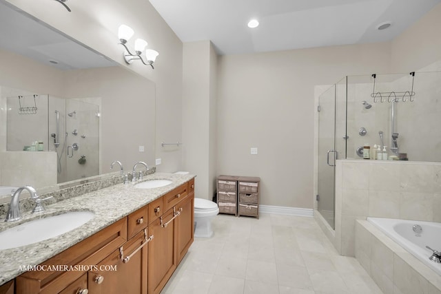 bathroom with a sink, a garden tub, and a stall shower