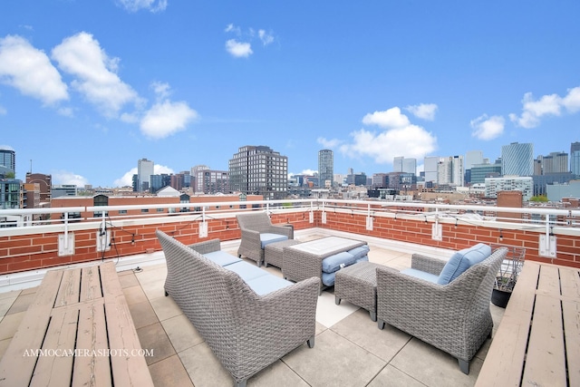 deck with a city view and an outdoor hangout area