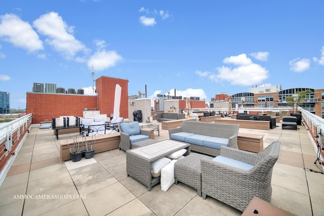 view of patio with a city view and outdoor lounge area