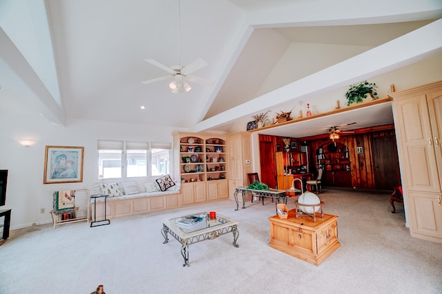 living room with a ceiling fan, light carpet, and high vaulted ceiling