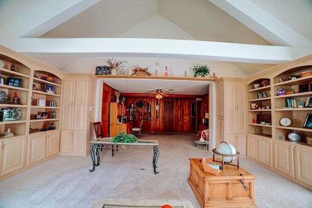 living area featuring light carpet, lofted ceiling, and ceiling fan