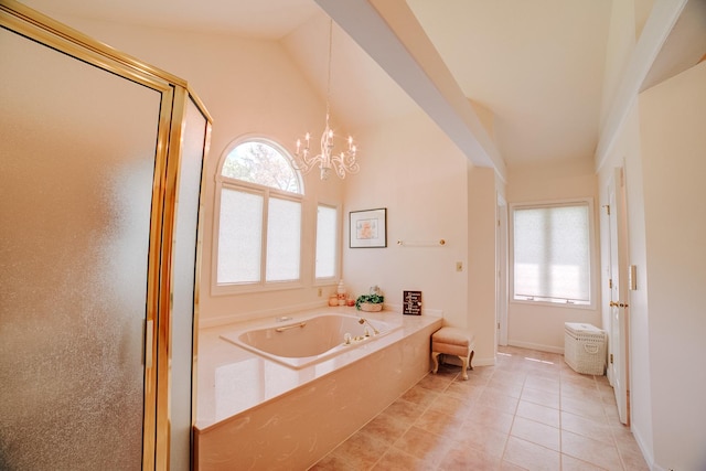 full bathroom with lofted ceiling, a notable chandelier, a bath, a shower stall, and tile patterned floors