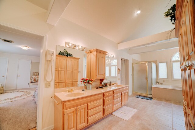 full bathroom with a shower stall, a garden tub, double vanity, and a sink