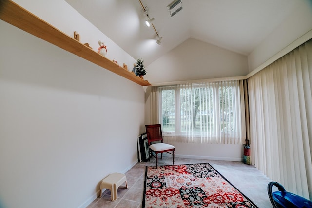 sitting room featuring vaulted ceiling, rail lighting, baseboards, and visible vents