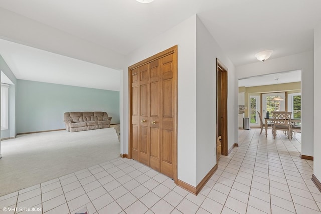 500 Easy St, Darien, IL 60561 - corridor with light tile patterned floors, light carpet, and baseboards
