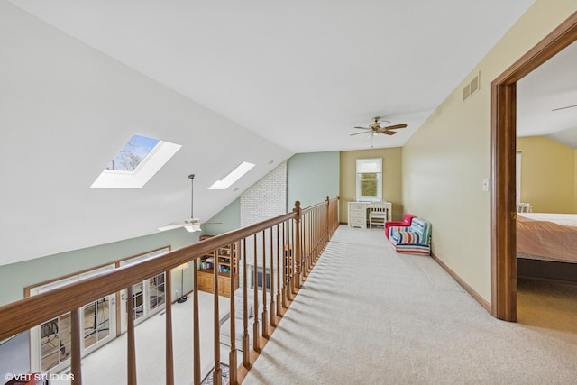 500 Easy St, Darien, IL 60561 - hallway featuring carpet flooring, visible vents, baseboards, and lofted ceiling with skylight
