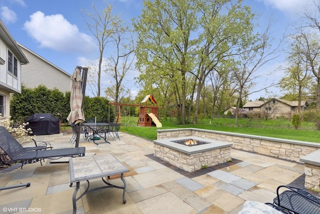 500 Easy St, Darien, IL 60561 - view of patio featuring outdoor dining space, grilling area, a playground, and a fire pit