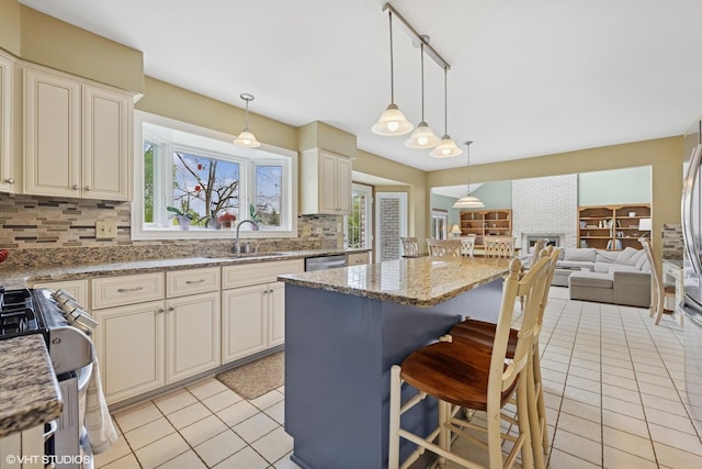500 Easy St, Darien, IL 60561 - kitchen with a sink, open floor plan, backsplash, a kitchen island, and light tile patterned flooring
