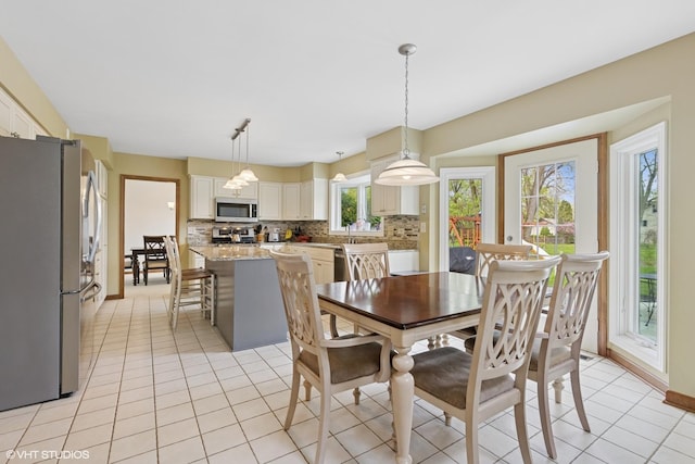 500 Easy St, Darien, IL 60561 - dining area with light tile patterned flooring and baseboards