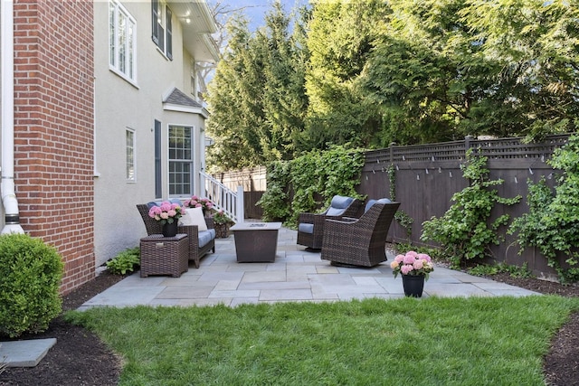 view of patio / terrace featuring fence and outdoor lounge area