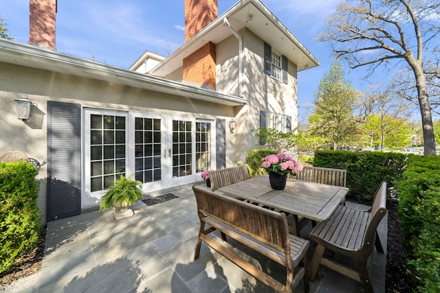 view of patio / terrace featuring french doors and outdoor dining space