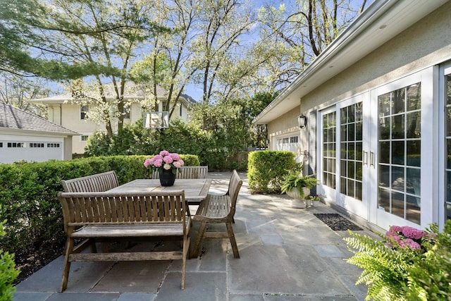 view of patio with outdoor dining area and french doors