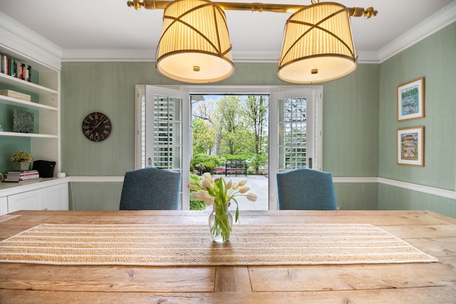 dining room featuring crown molding