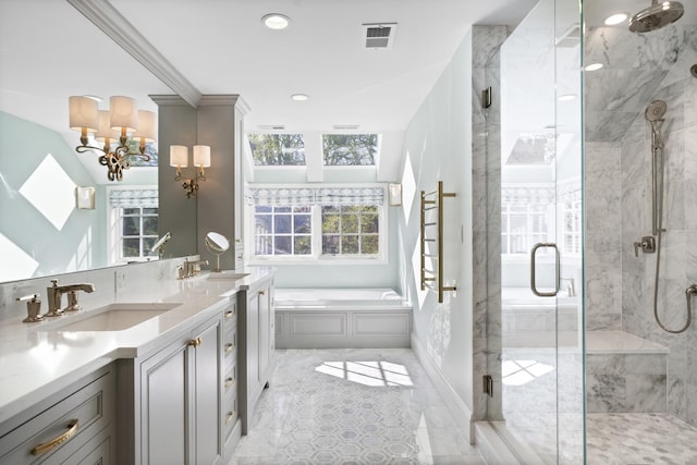 bathroom with a garden tub, a marble finish shower, double vanity, a chandelier, and recessed lighting