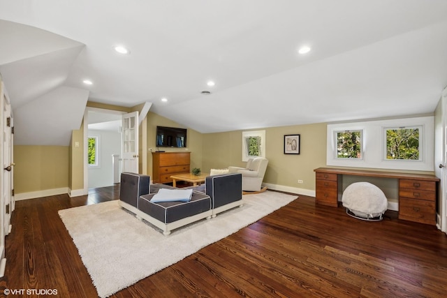 living room with wood finished floors, baseboards, plenty of natural light, lofted ceiling, and recessed lighting