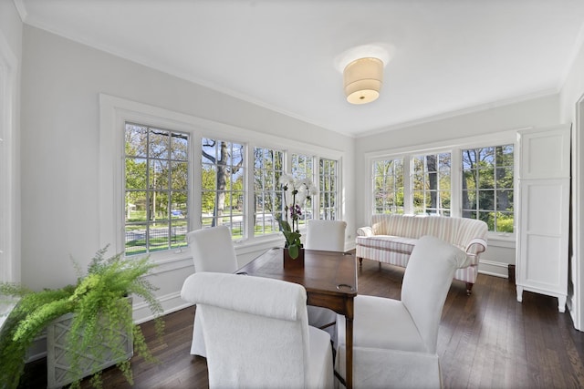 sunroom / solarium featuring ornamental molding, wood-type flooring, baseboards, and french doors