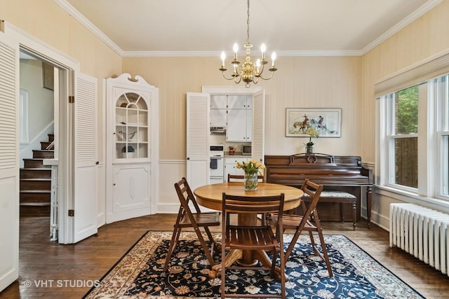 625 Greenbriar Ln, Lake Forest, IL 60045 - dining room with radiator, crown molding, dark wood finished floors, a chandelier, and stairway